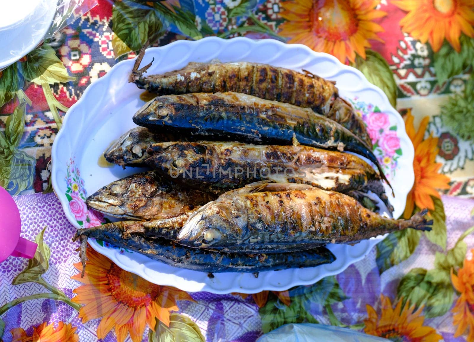 grilled spicy mackerel fish on a dish. top view. grilled fish by igor010