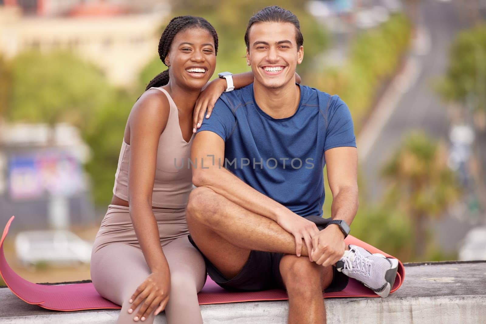 Fitness, yoga and portrait of couple in city on break after stretching, training or workout. Love, interracial couple and man and woman sitting outdoors on mat after pilates exercise for wellness. by YuriArcurs