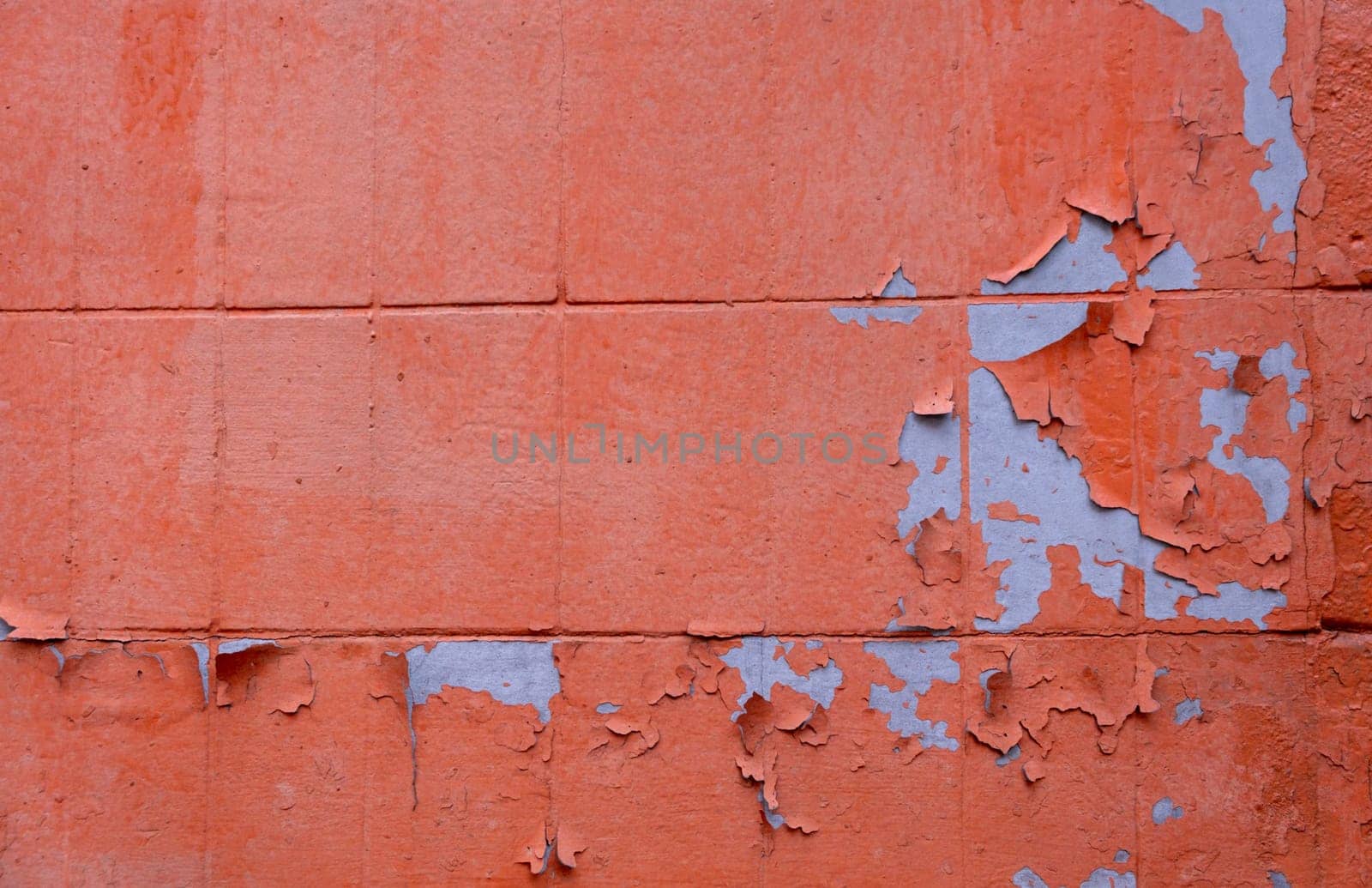 Grunge Concrete Wall Texture peeling paint, old cracked wall peach or pink colored closeup. old red brick wall, pattern, natural material