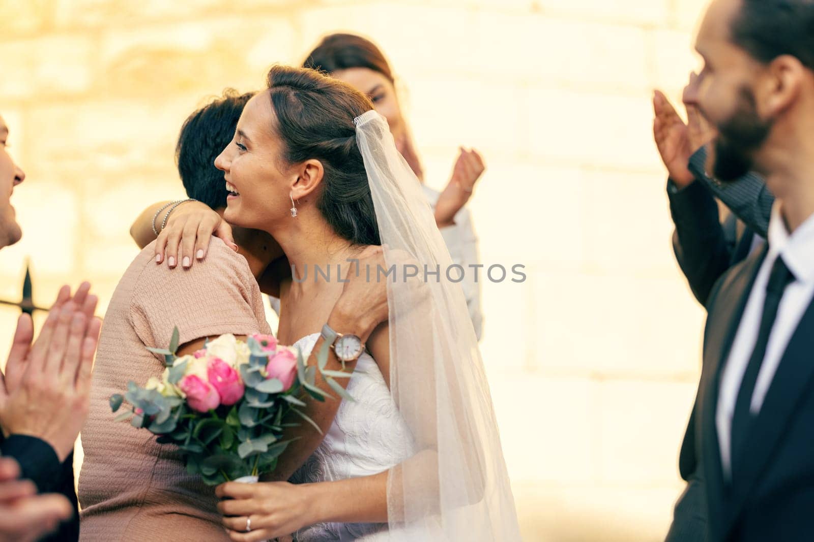 Wedding, marriage and bride hug family guests with a smile while leave church with groom after marrying, celebration and event to celebrate love. Romance, commitment and happy married couple together by YuriArcurs