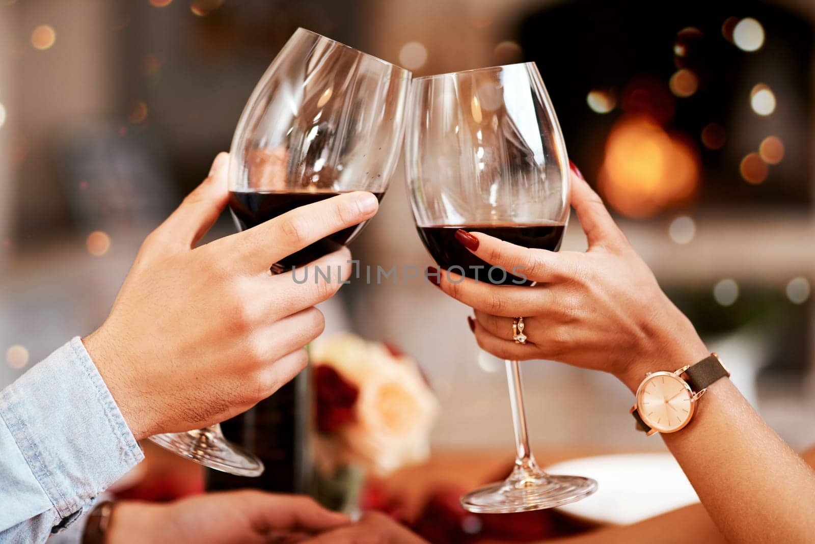 Red wine, glass and couple hands toast, celebrate or cheers in 5 star restaurant or fine dining alcohol store. Romance love, marriage anniversary or people on Valentines Day date for holiday event.