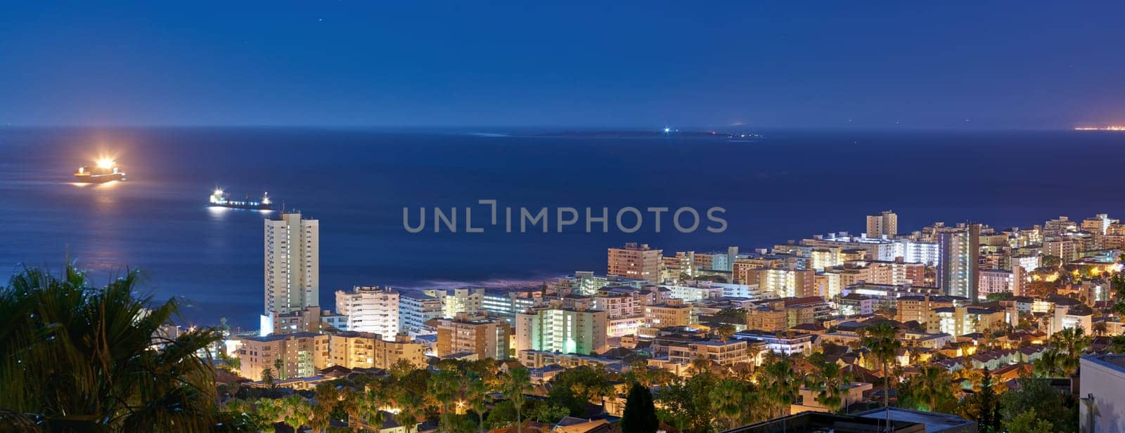 Cityscape, buildings and urban landscape at night, skyline and location with architecture, landmark and travel. City, skyscraper and banner with Cape Town view, rooftop and tourism with destination.