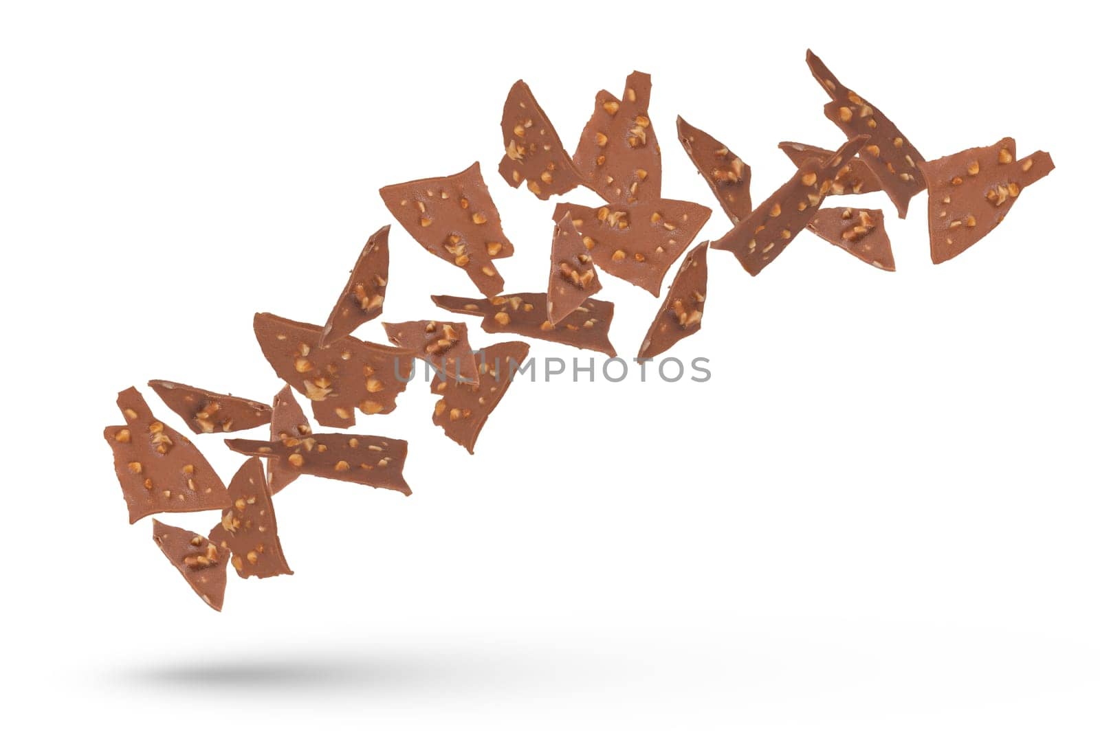 Chocolate pieces of ice cream glaze with nuts. Pieces of chocolate fall on a white isolated background. Suitable for pasting into a design or project. High quality photo