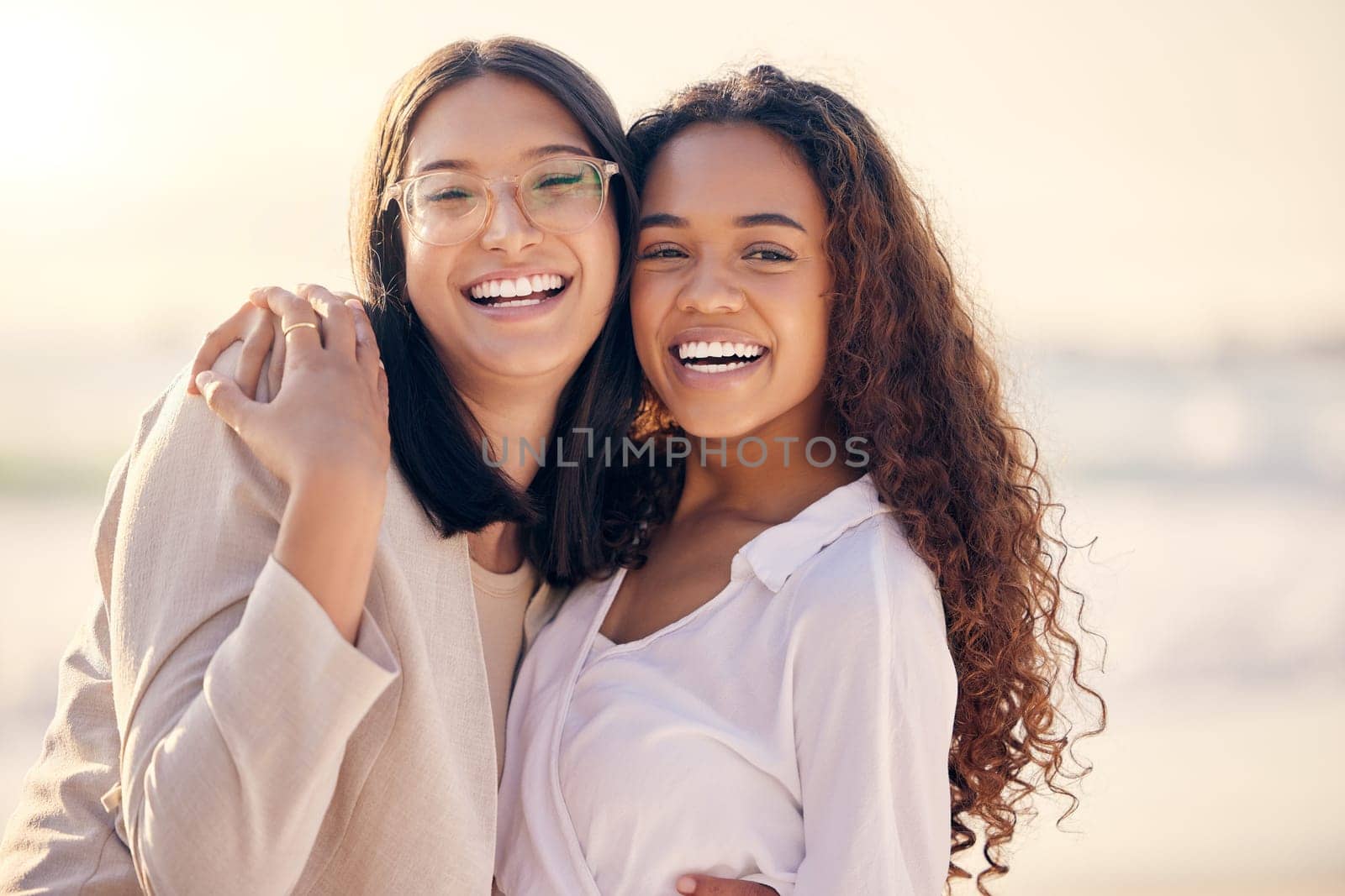 Portrait, lesbian and women hug, beach and love with freedom, equality and romance with happiness. Face, couple and girls embrace, lgbtq relationship and commitment with pride and seaside vacation.