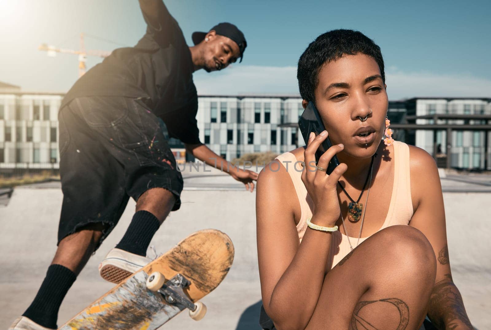 Skateboard, summer and phone call with friends at urban city hangout in sunshine together. Skater people at recreation facility for outdoor activity and 5g mobile connection in New York