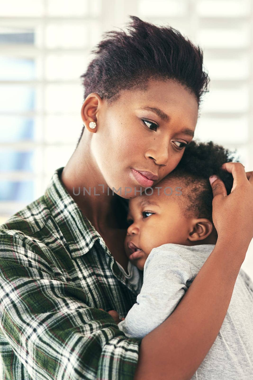 Theres no bond stronger.... Shot of a mother cradling her little baby boy. by YuriArcurs