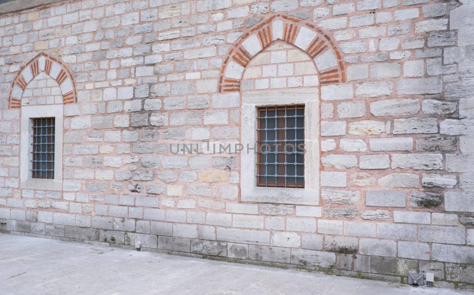 Window on a brick wall under brick arch