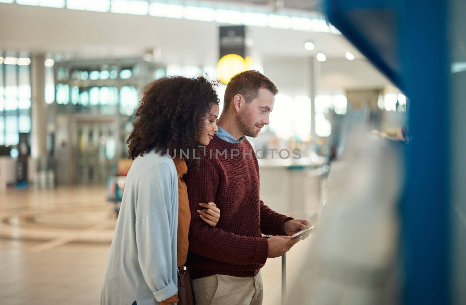 Payment, airport and couple with ticket for self service, checkout or online booking on machine. Paying, man and woman happy, hug and bonding while at POS for flight schedule, travel and information by YuriArcurs