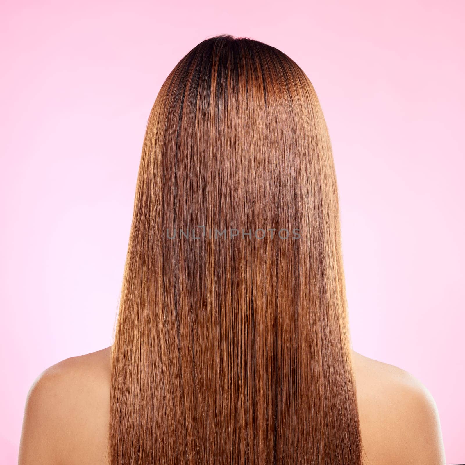 Beauty, hair and back of woman in studio for shampoo, keratin and salon treatment. Health, shine and self care with girl model and growth for glow, textures or cosmetology isolated on pink background by YuriArcurs