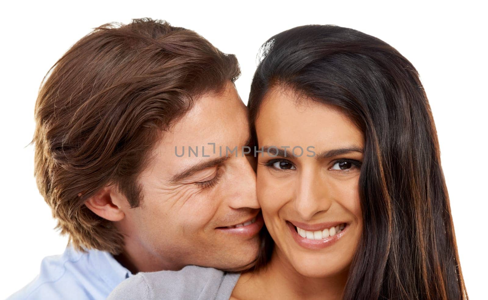 Hug, portrait and love by couple in studio, happy and relax while bonding on white background. Interracial, romance and face of man hugging woman for valentines day, embrace and relationship isolated.