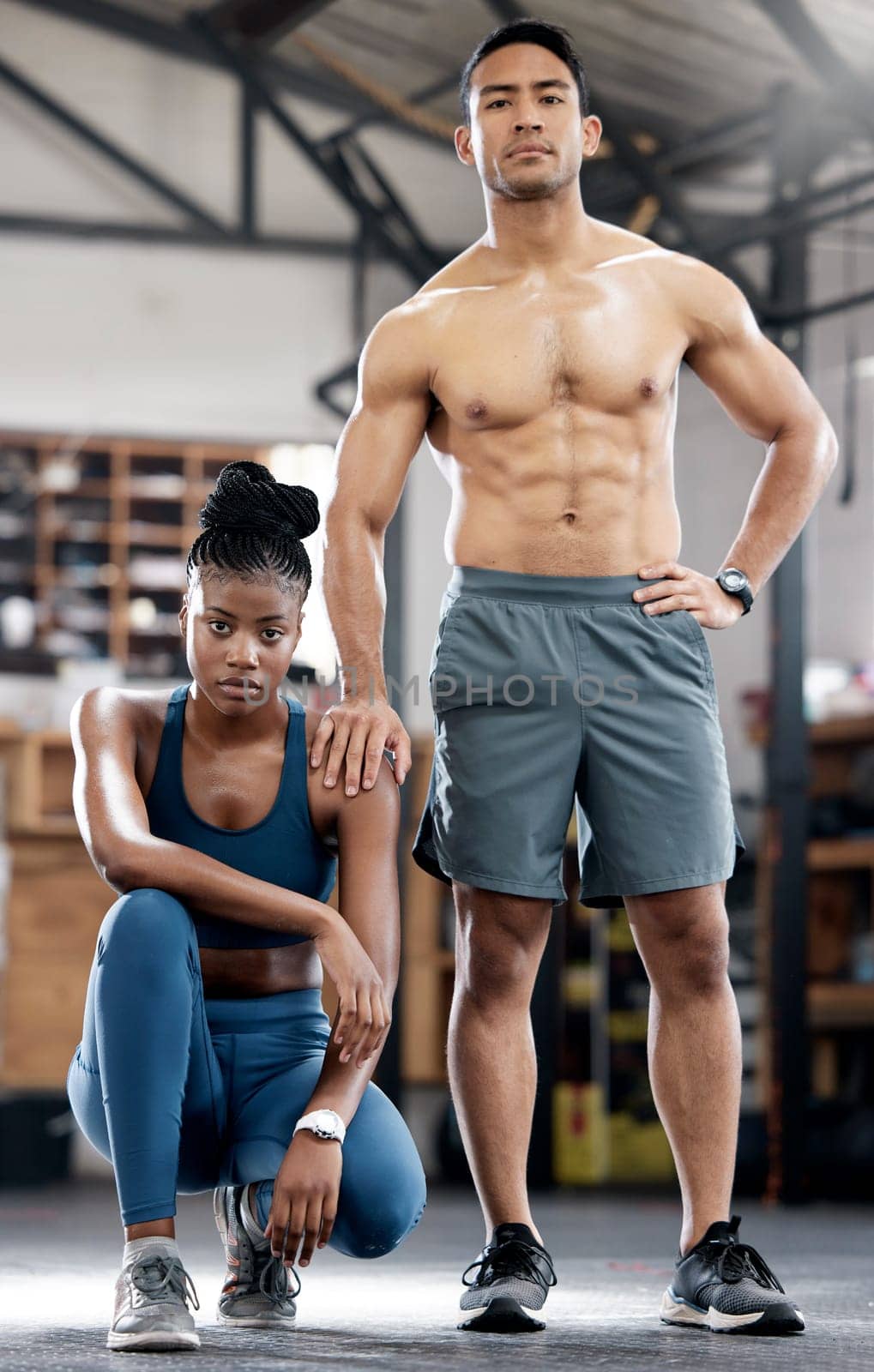 Fitness, portrait or coach with a black woman at a gym training, exercise or body workout. Team partnership, personal trainer or African client with pride in health club to start exercising activity by YuriArcurs