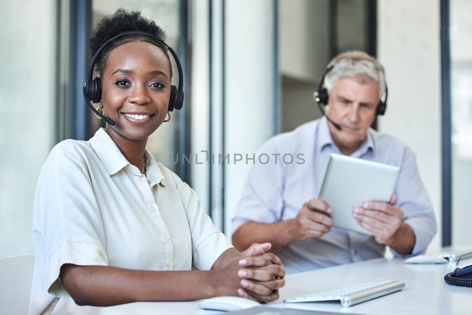 Black woman, portrait and call center work of a employee with telemarketing and contact us job. Phone consultation, African female person and web support in office with staff working on online desk.