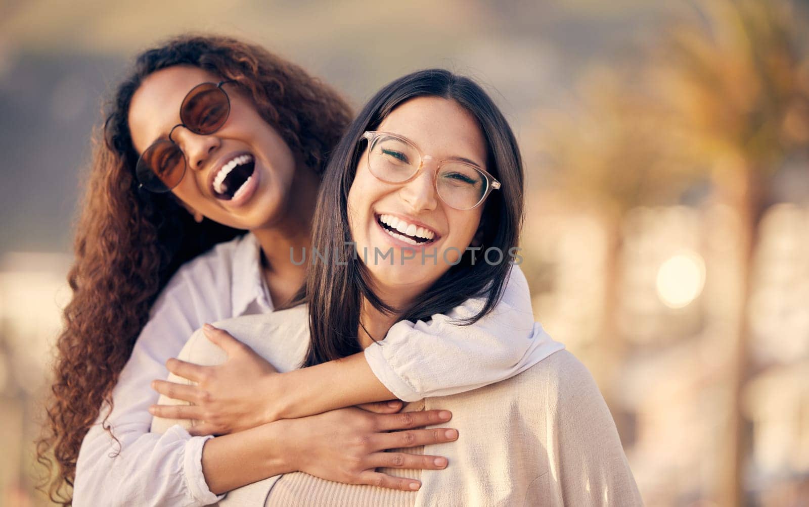 Portrait, lesbian and couple outdoor, hug and smile with freedom, romance and sexuality with love. Face, women and girls embrace, lgbtq relationship and adventure with happiness, romantic and pride by YuriArcurs