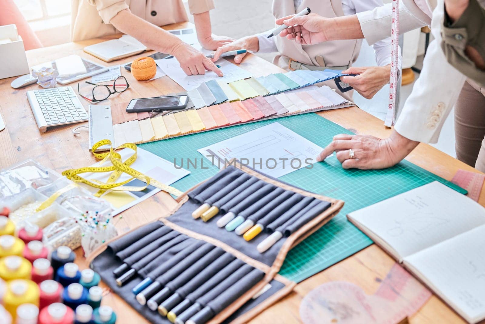 Planning, teamwork and fashion designer hands in creative project, collaboration and textile industry. Startup, sketch and studio, workshop or manufacturing people ideas, art vision and color palette.