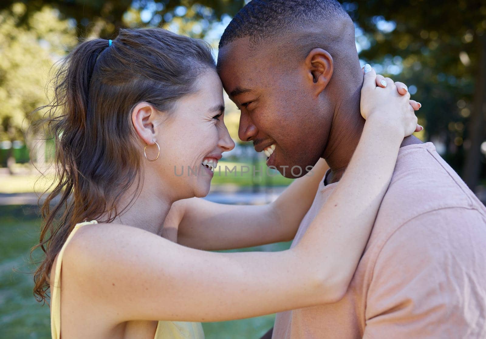 Happy, love and interracial couple at park for date with diversity, summer celebration and valentines day. Race, black man with partner or people together in garden excited for anniversary in nature.