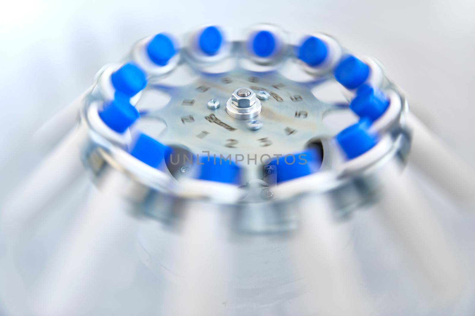 Blood test tubes in centrifuge. Plasma preparation in medical.