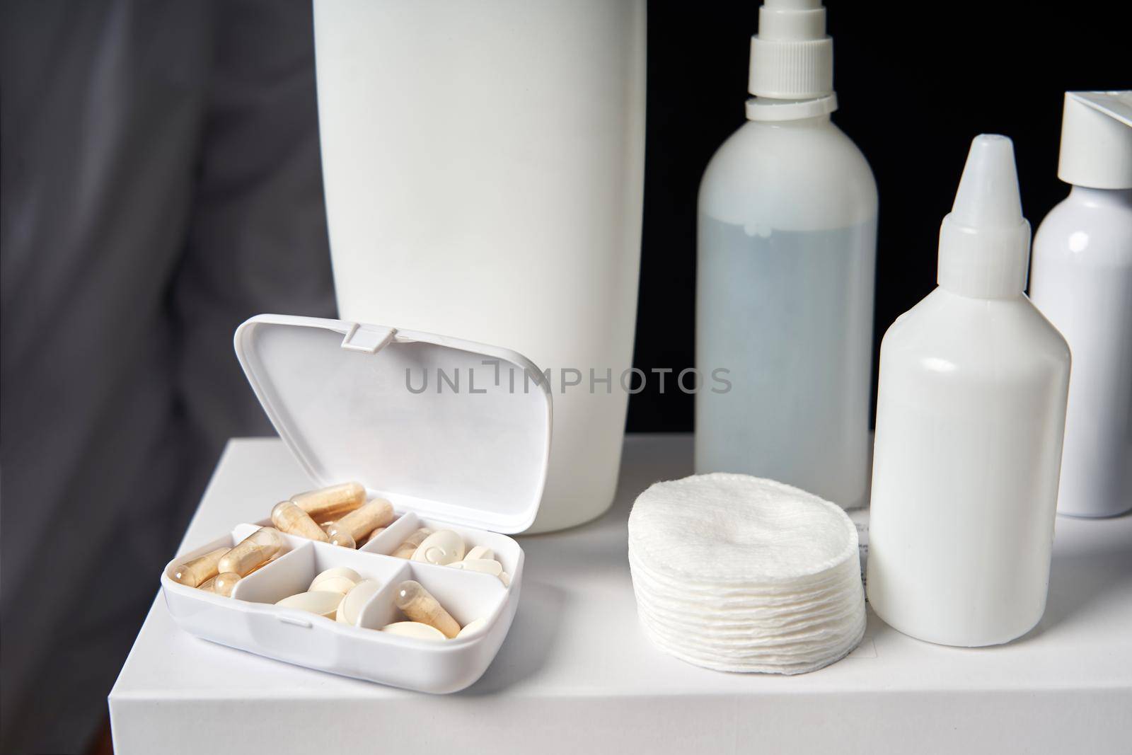White box with many pills and Blank medicine bottles