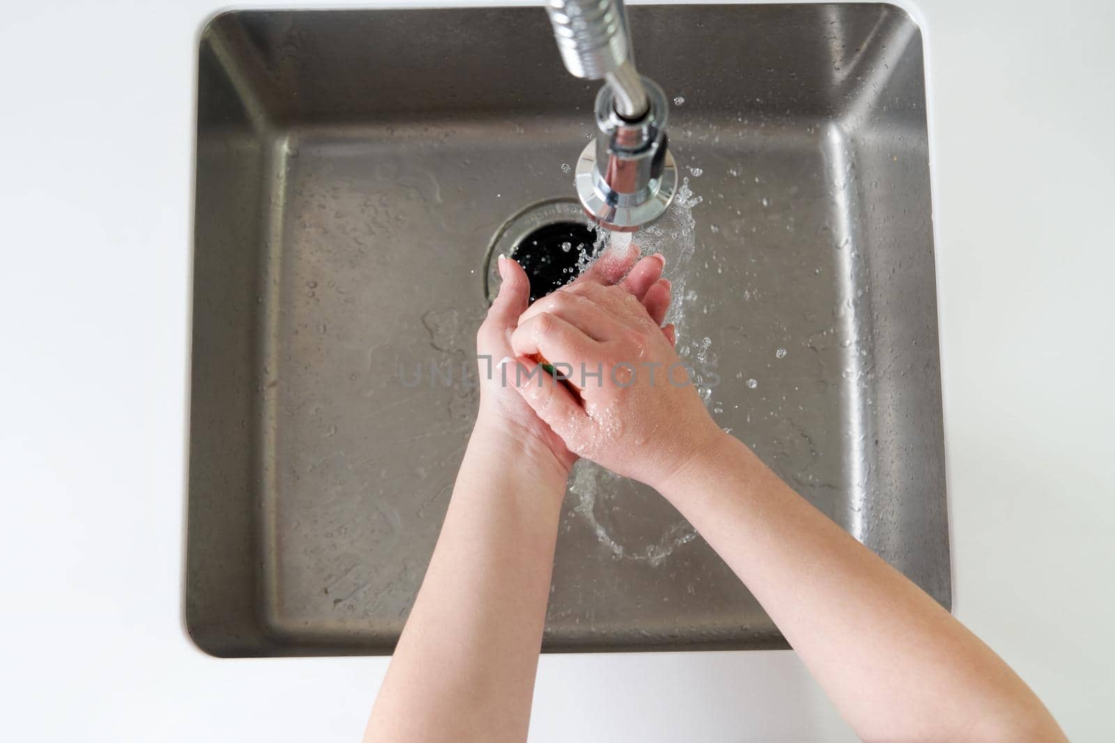 Woman washing hands with antibacterial soap for corona virus prevention, hygiene to stop spreading coronavirus covid19