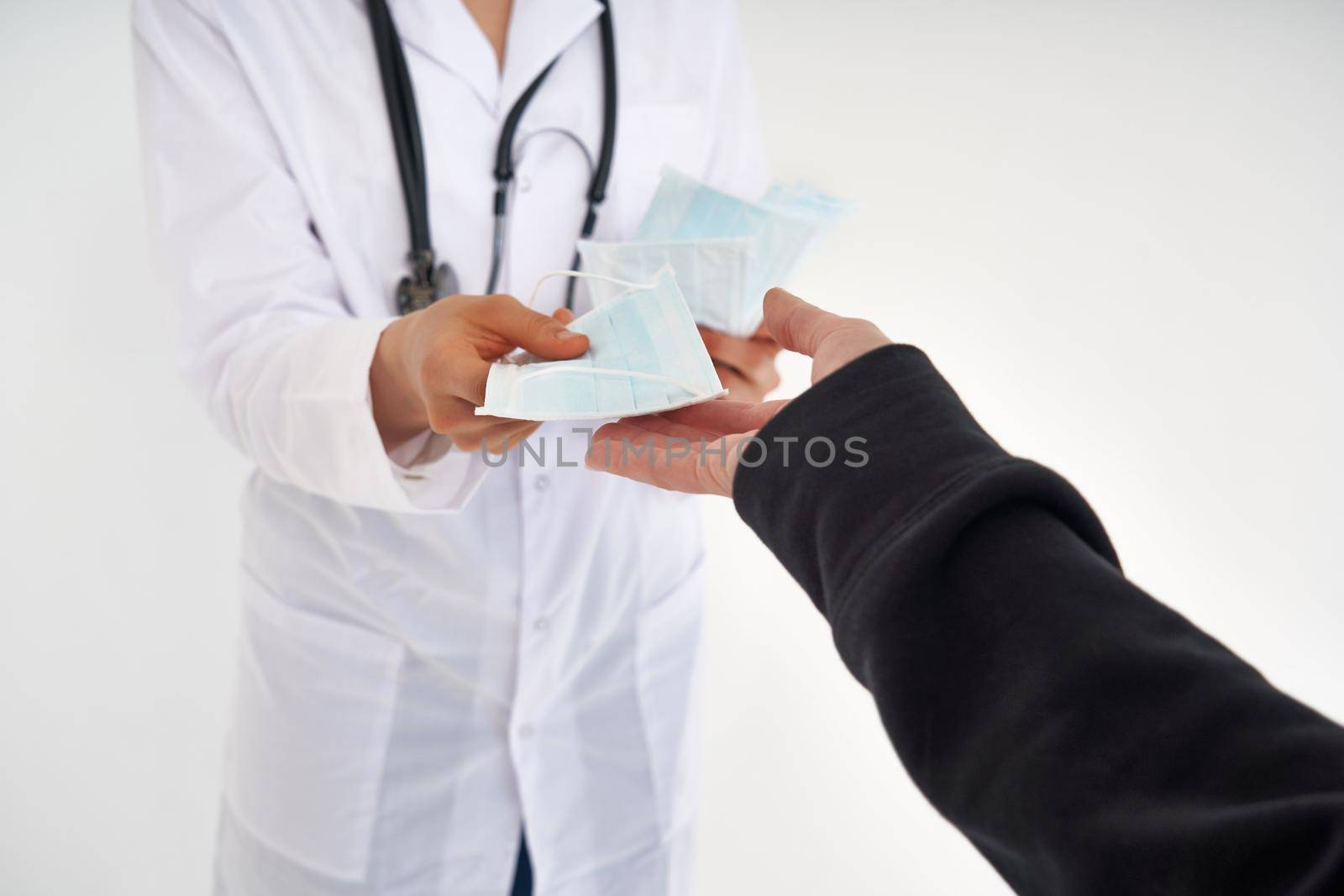 Doctor or nurse recommend to use protective face mask to protect from virus infection