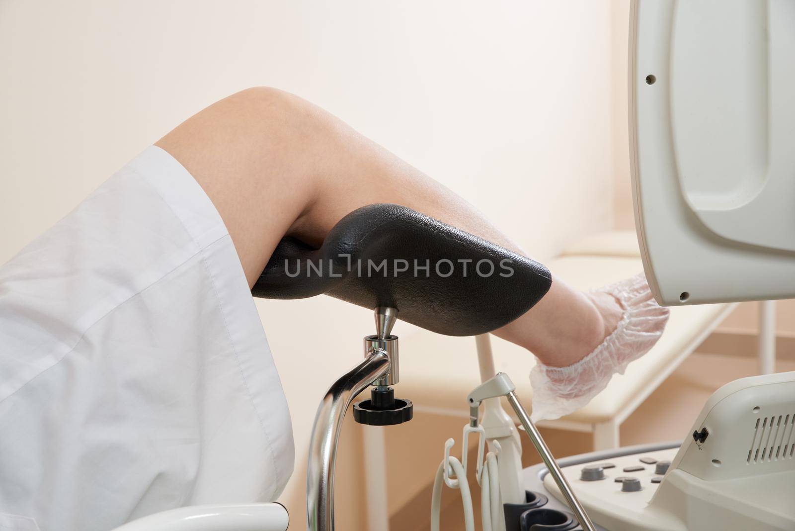 Cropped view of woman in gynecological chair in medical office