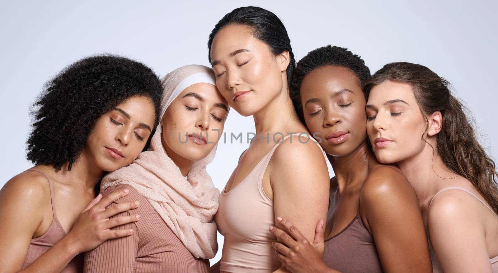 Face, beauty and group of women with eyes closed in studio isolated on gray background. Diversity, skincare cosmetics or makeup of girls, female models or friends posing for inclusion or self love