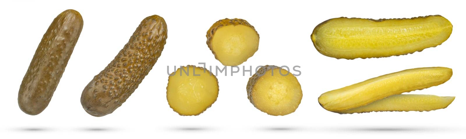 Set of pickles on a white isolated background. Pickled cucumbers of different sizes and cutting methods on a white background. The concept of canning, pickling and harvesting vegetables