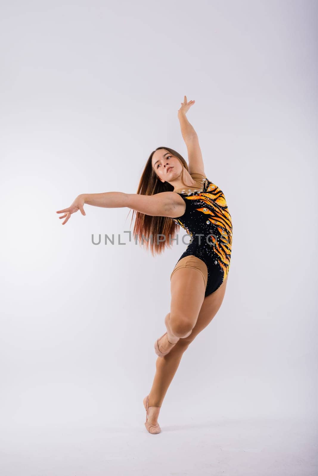 High jump, flight. Little flexible girl, rhythmic gymnastics artist jumping. Grace motion, action. by Zelenin