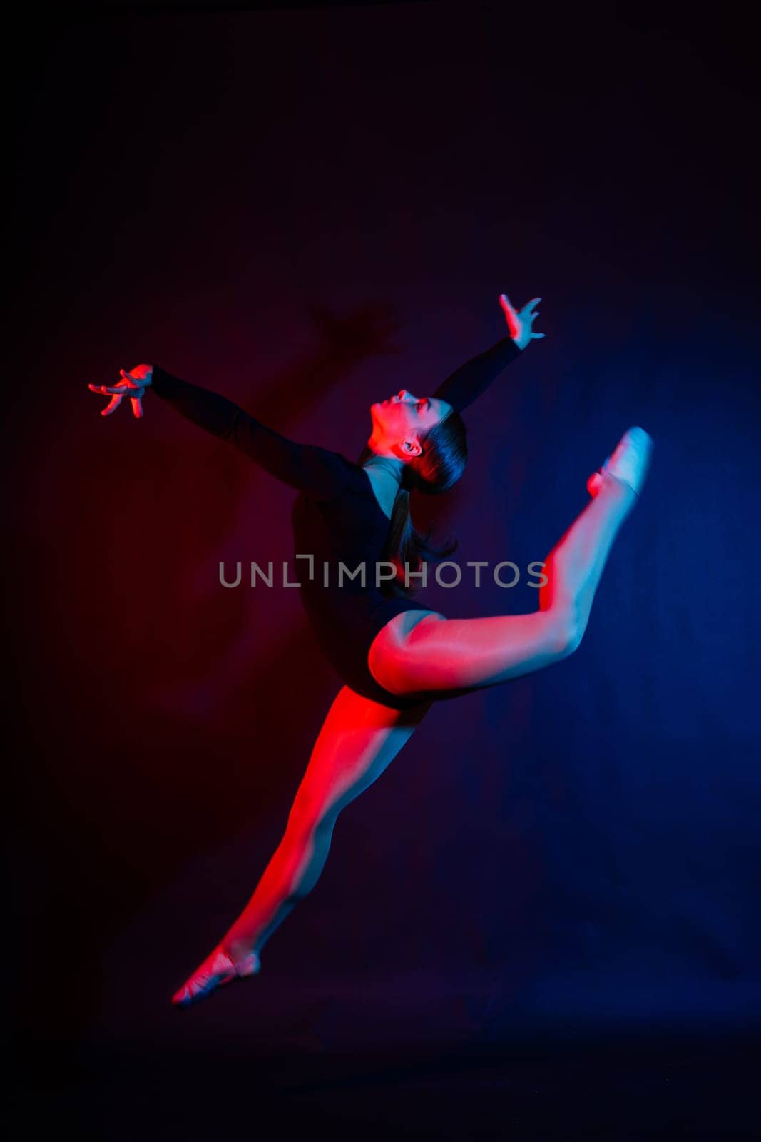 High jump, flight. Flexible girl, rhythmic gymnastics artist jumping. Grace motion action