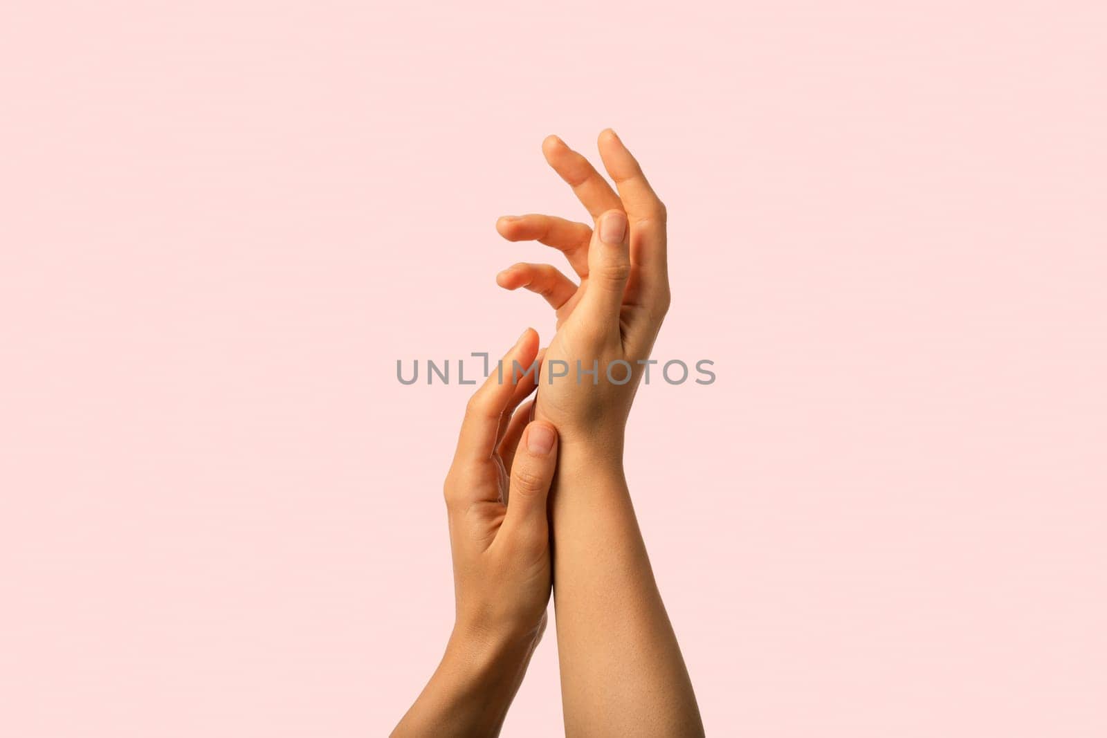 Sesonial hands skin protection. closeup woman applying protective cream on hands by AndreiDavid