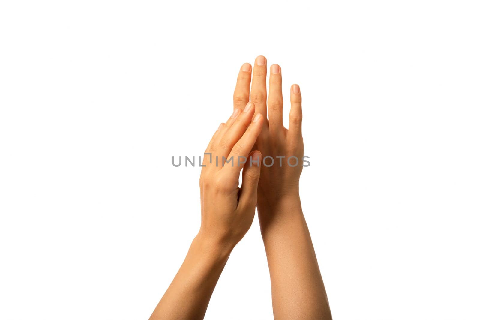 Close up woman hands moisturised with protective cream anti age treatment isolated on white background.
