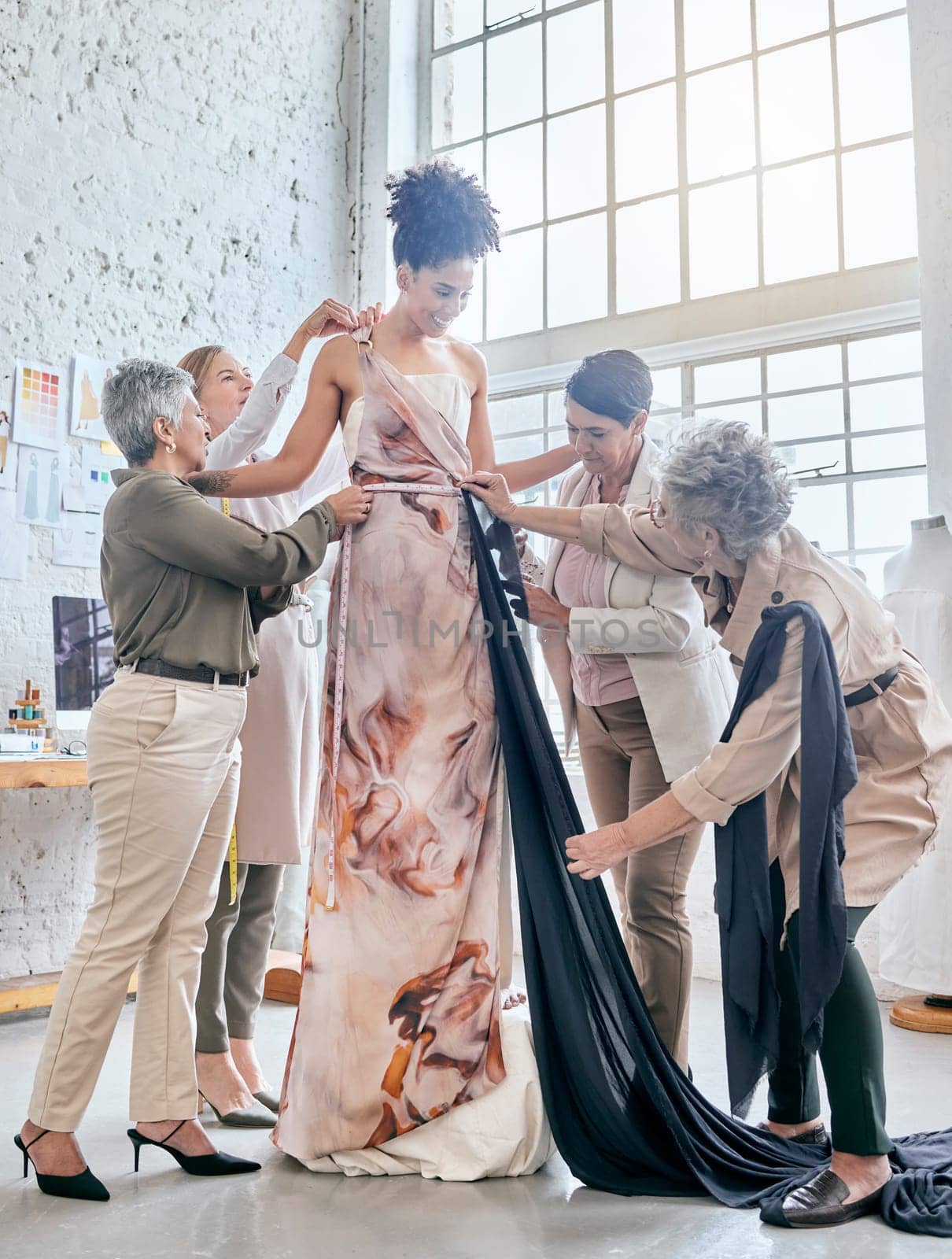 Designer women, help model and fitting dress, design and teamwork for runway fashion vision in workshop. Happy creative team, woman collaboration and test fabric with diversity, goals or helping hand.