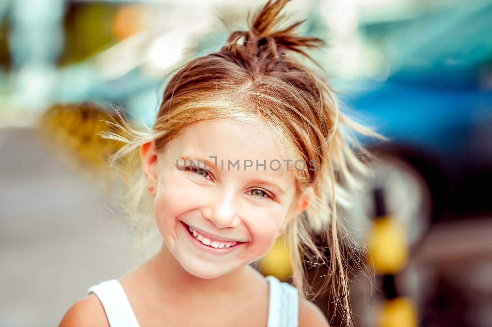 Portrait of a happy cute liitle girl close-up