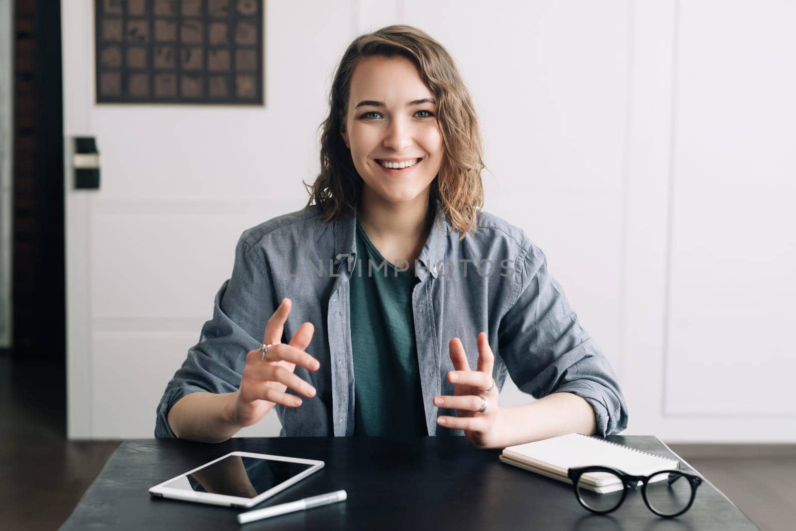 Confident Businesswoman Engaging in a Video Conference, Communicating through Web Camera from Office or Home. Professional and Modern Business Communication Concept