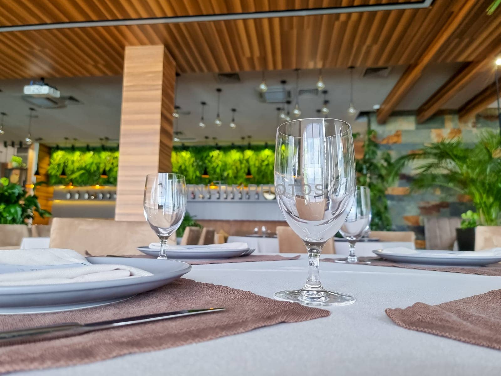 Empty glasses set in restaurant. Part of interior