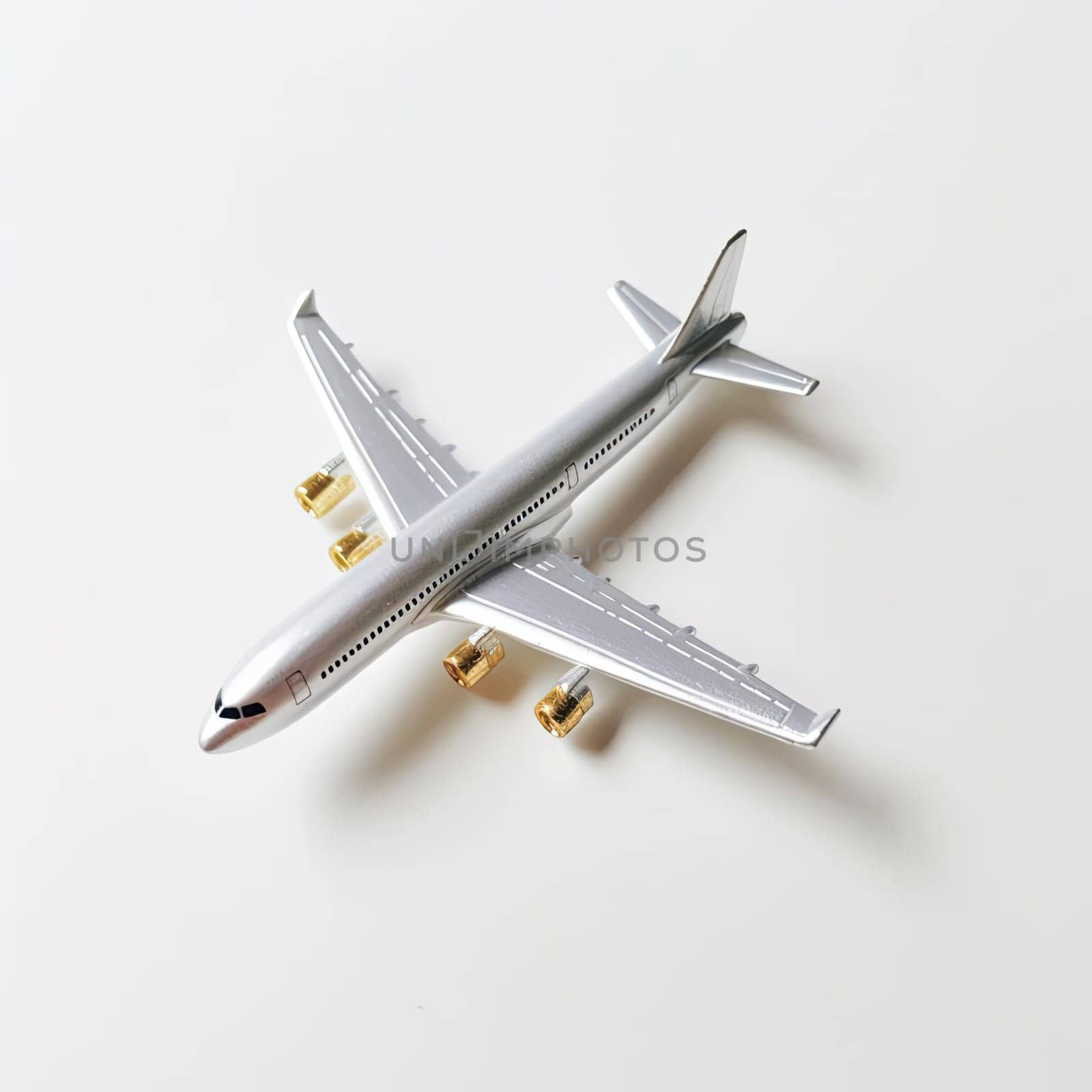 Airplane model on white background - top view - travel concept by eduardobellotto