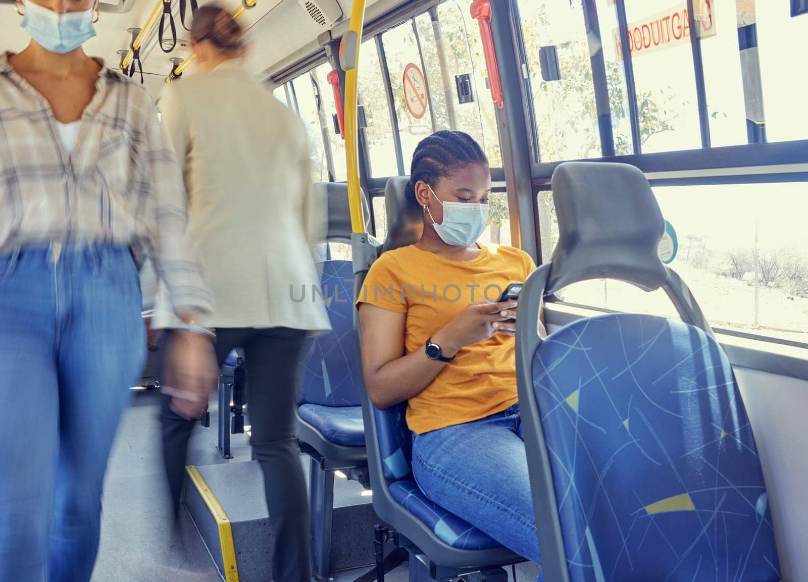 Travel, covid and woman on a bus with face mask for compliance, safety and bacteria protection in a city. Corona, public transport and girl riding busy transportation downtown during global pandemic by YuriArcurs