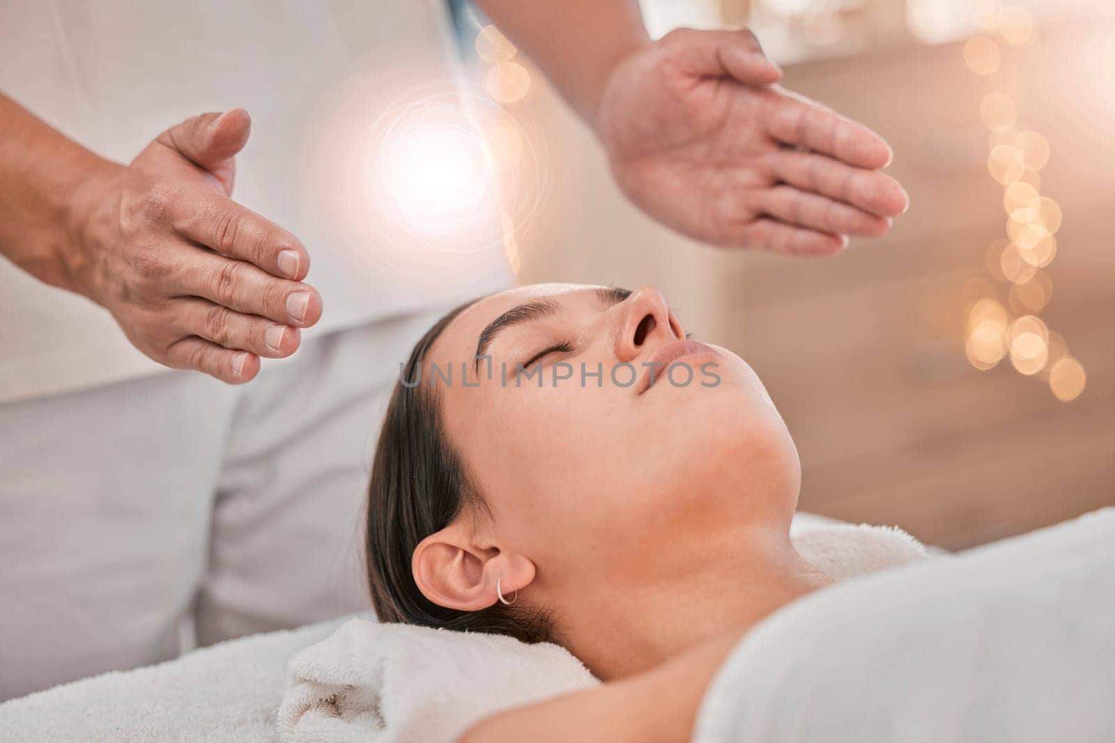 Woman, hands or relax reiki spa for stress management, headache relief or healthcare wellness in holistic clinic. Energy healer, man or mind chakra peace for sleeping patient and special effects glow.