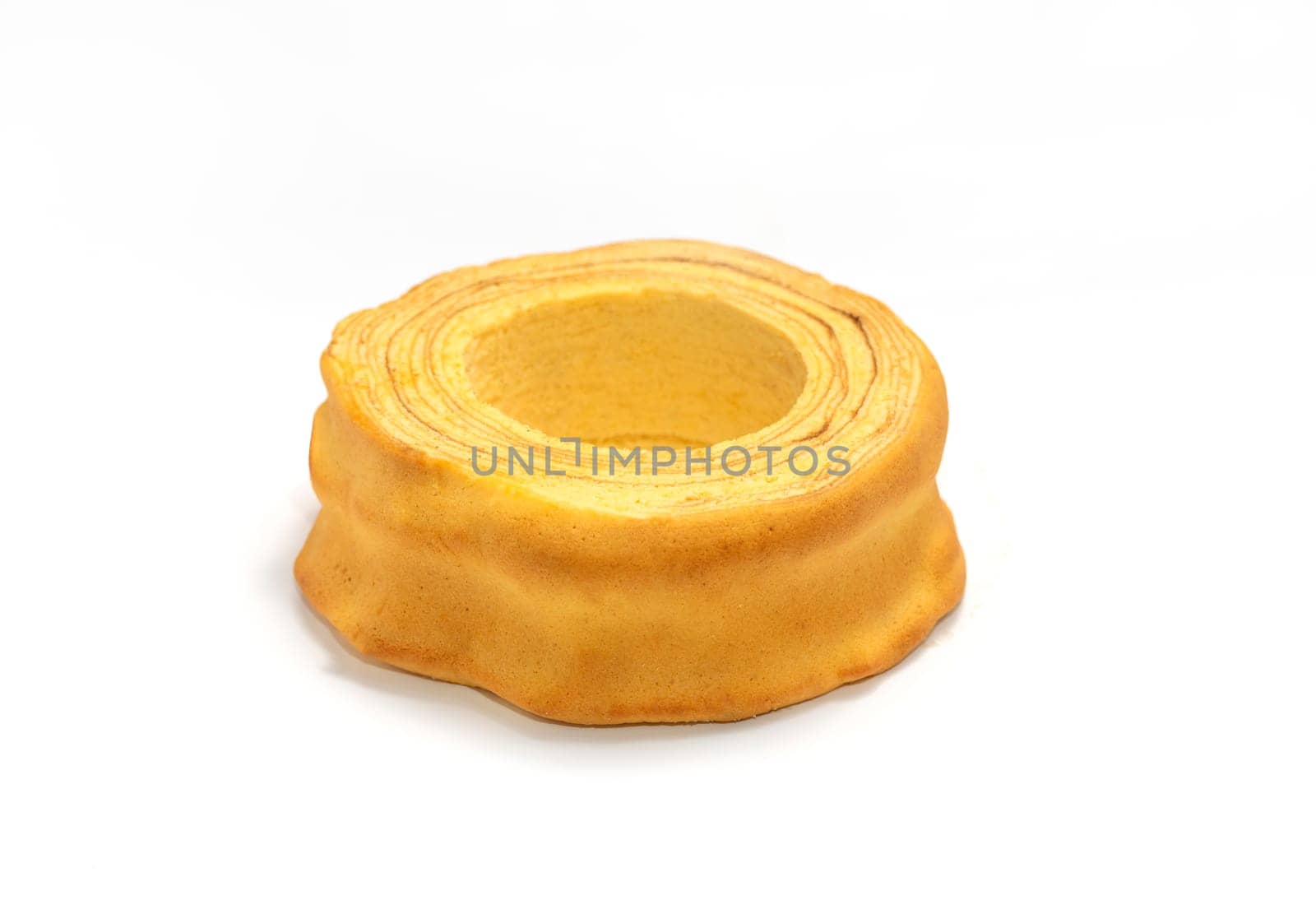Isolated baumkuchen, Sakotis ,sekacz pie, traditional spit egg cake on white background. Copy space, horizontal plane.