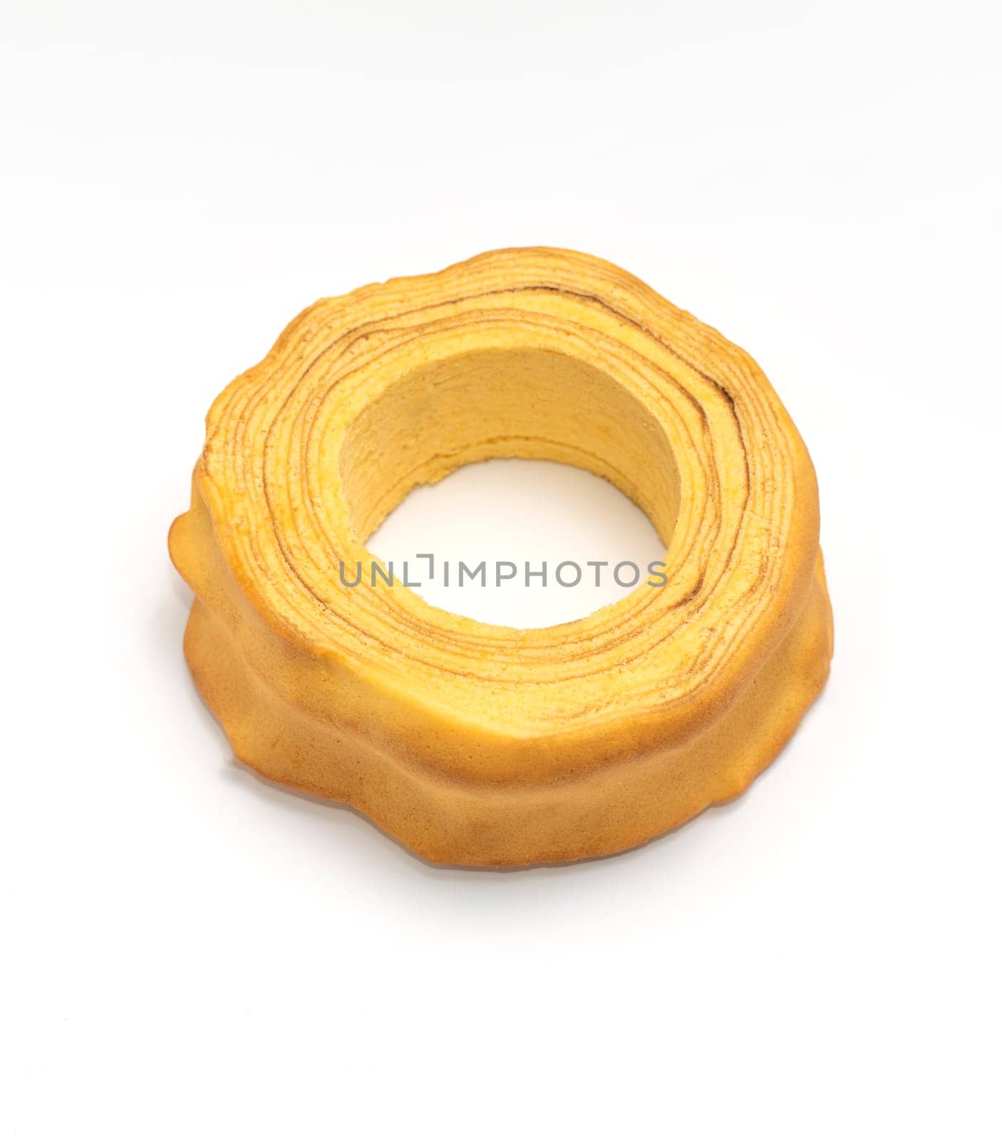 Isolated baumkuchen, Sakotis ,sekacz pie, traditional spit egg cake on white background. Flatly, copy space, horizontal plane