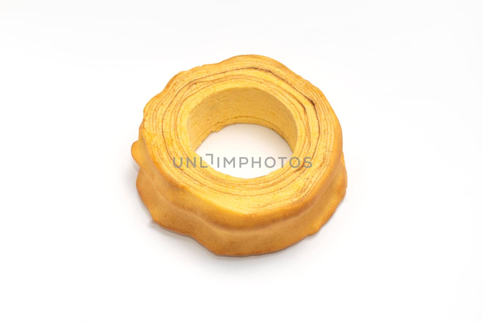 Isolated baumkuchen, Sakotis ,sekacz pie, traditional spit cake in lithuanian, polish, german, belarusian cuisine on white background Horizontal plane. Copy space, top view.
