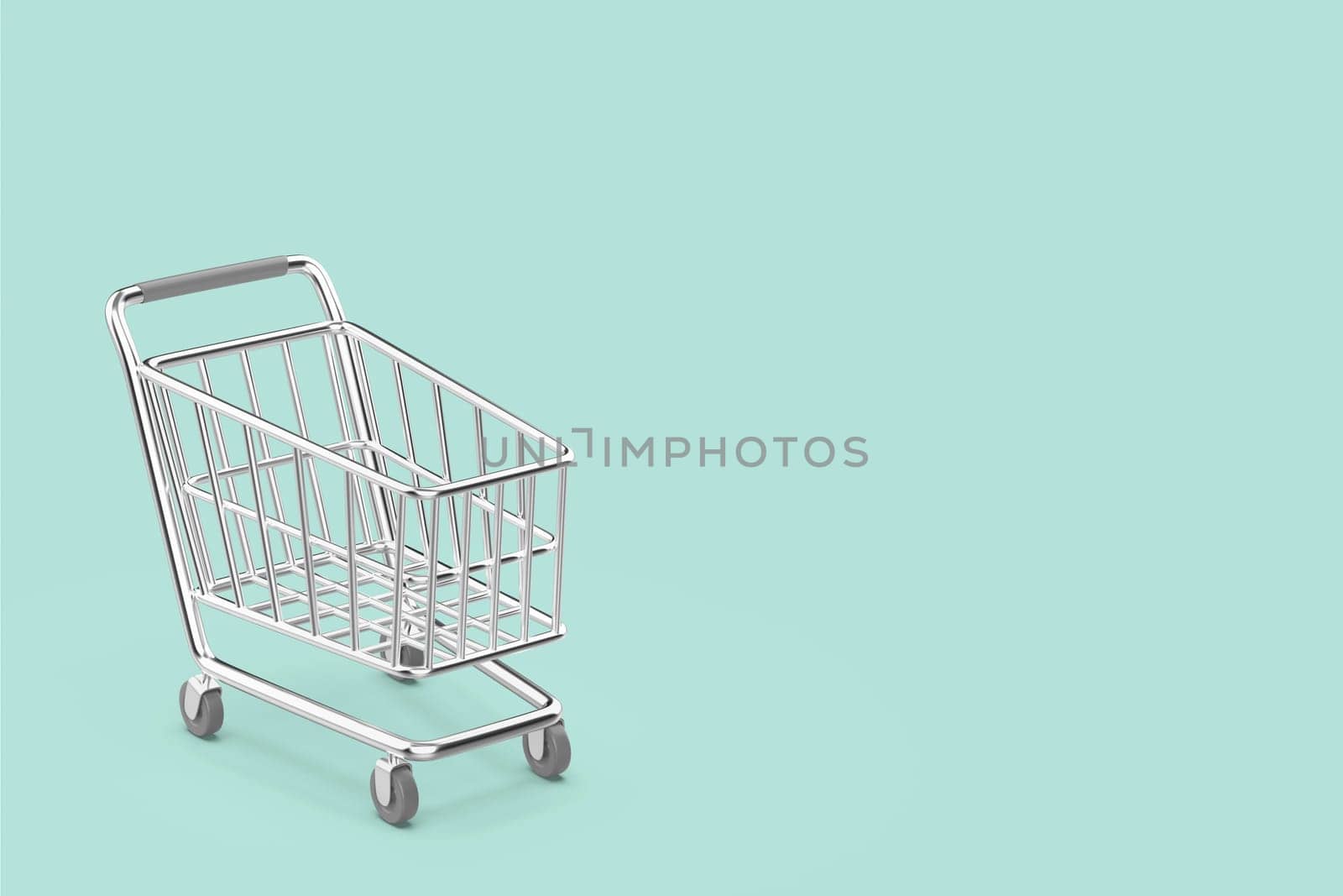 Empty silver colored shopping cart on turquoise background