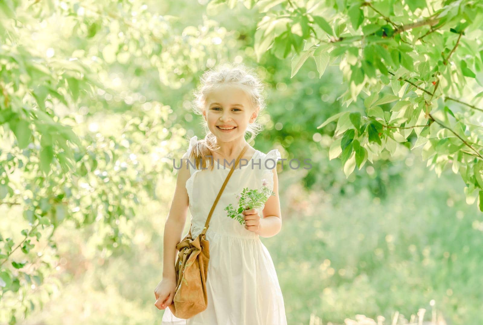 Smiling little girl in the ark with flower by tan4ikk1