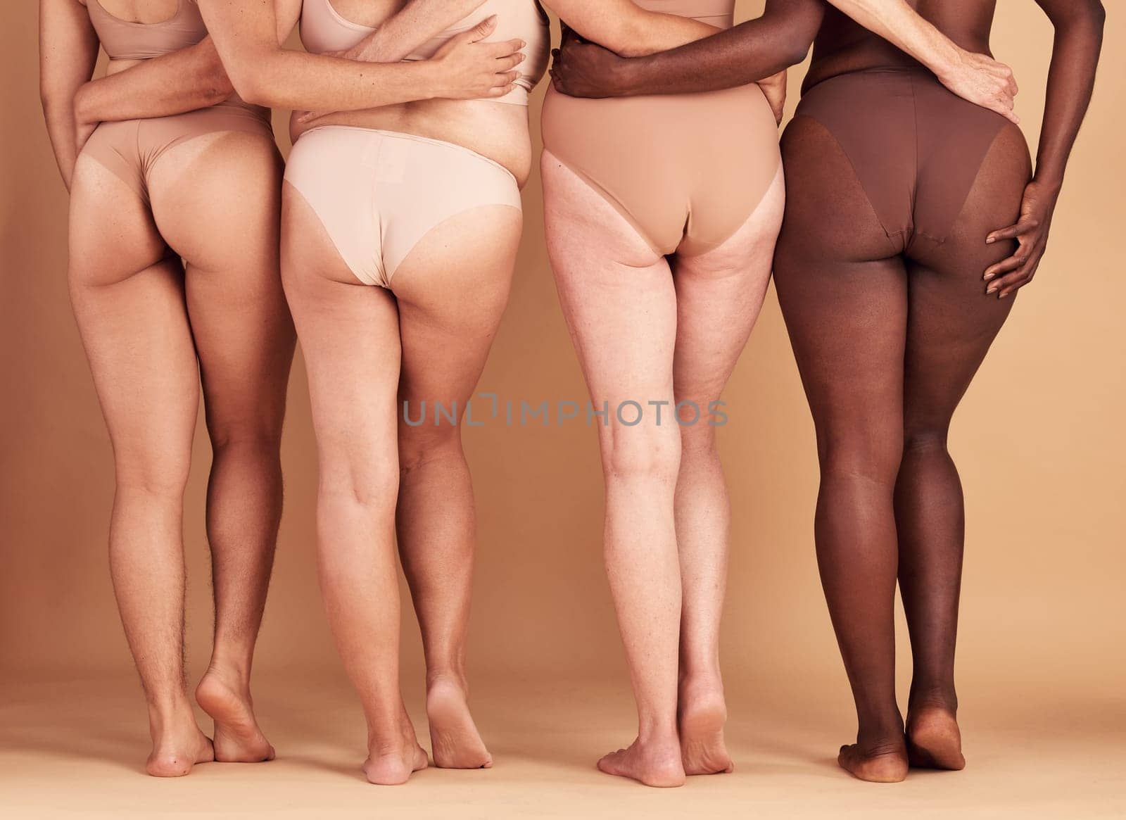 Women group, lingerie and butt in studio for wellness, fashion and diversity with plus size in unity. Back, bum and woman model team with solidarity, body positive or health for beauty by background.