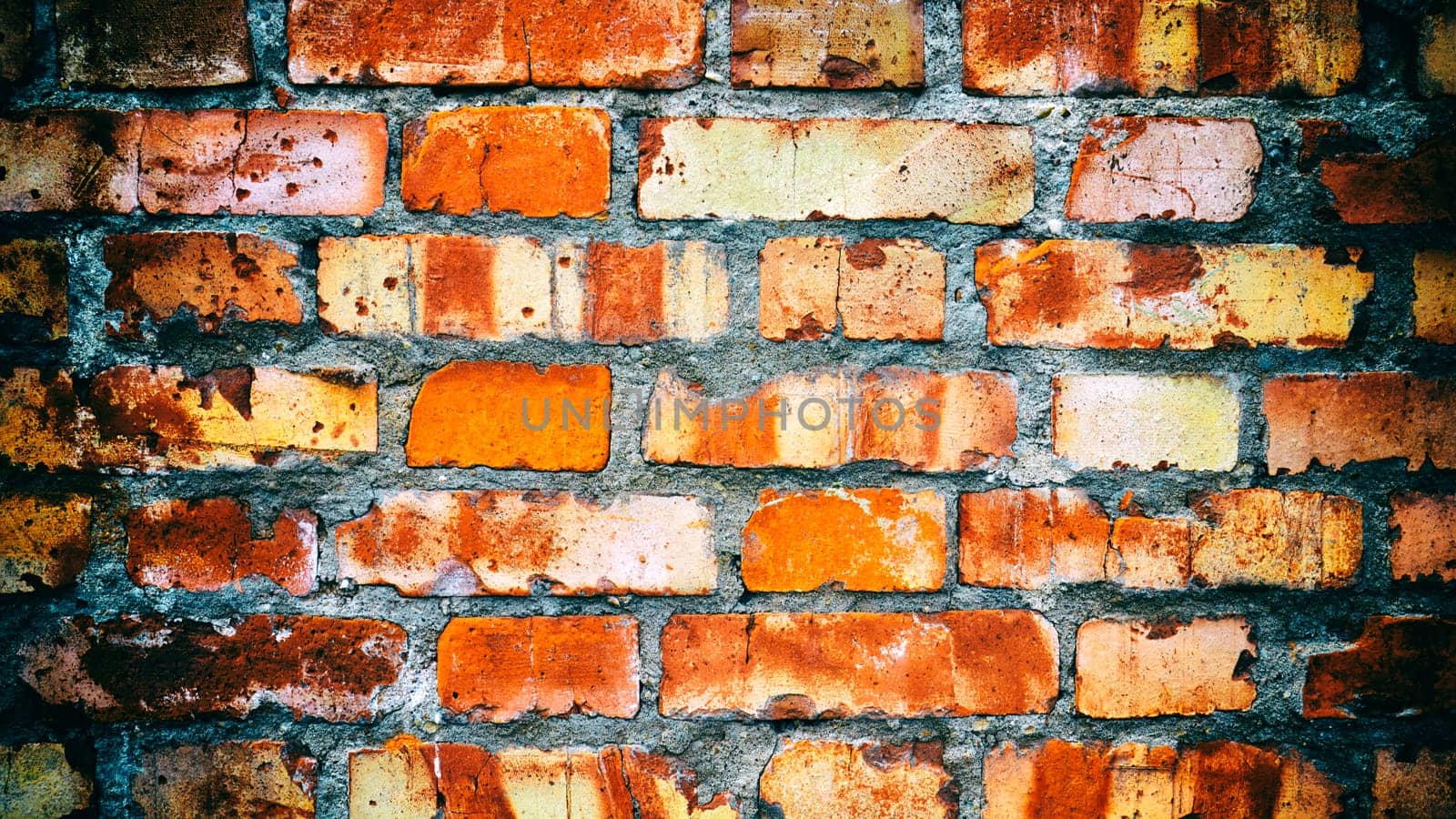 Close-up of an old red brick wall. Added vintage camera and vignetting effect