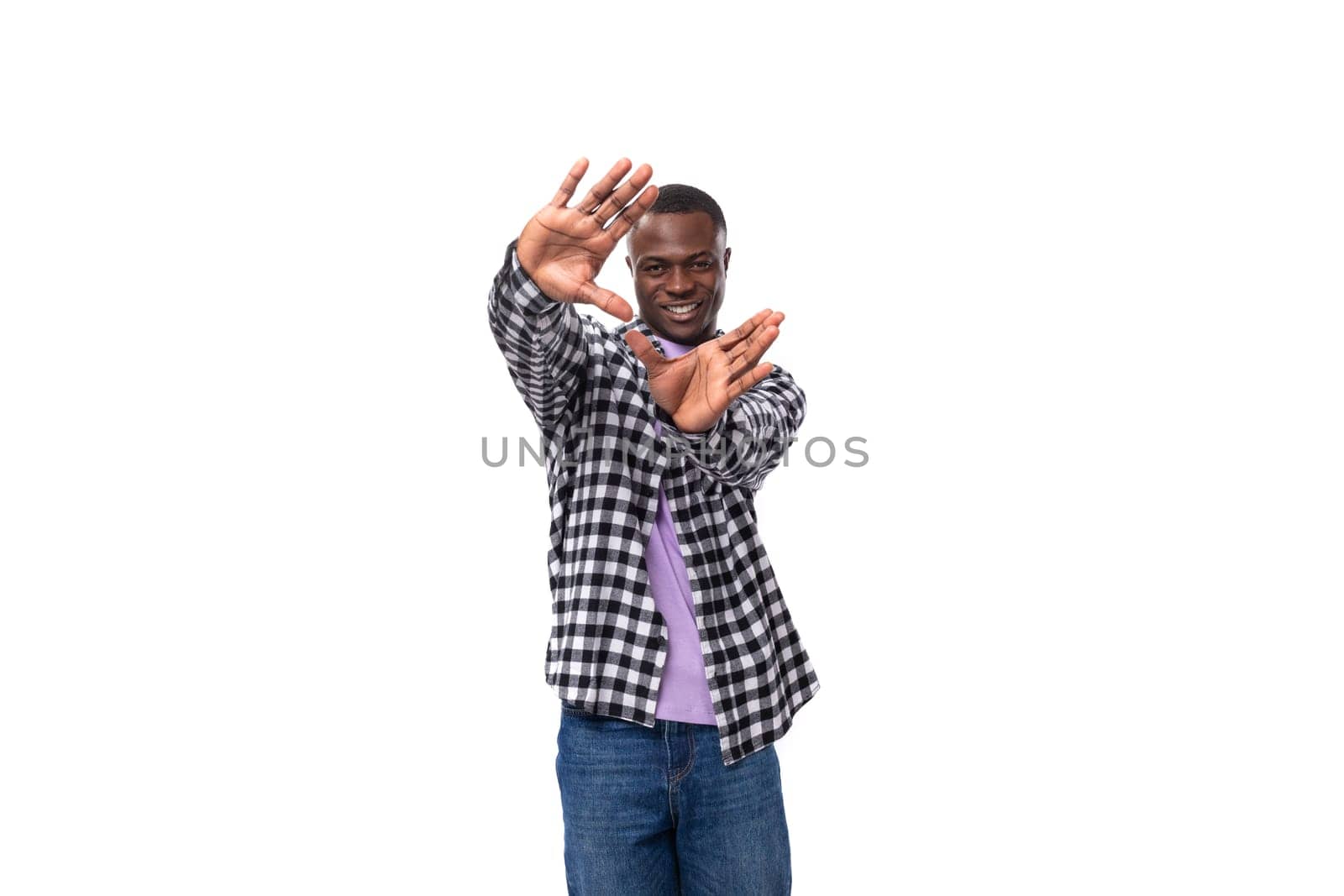 stylish young american guy with short haircut dressed casually on white background with copy space.