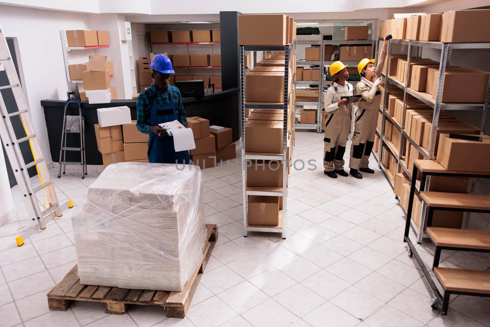 Industrial warehouse coworkers doing freight inventory, managing parcel delivery by DCStudio