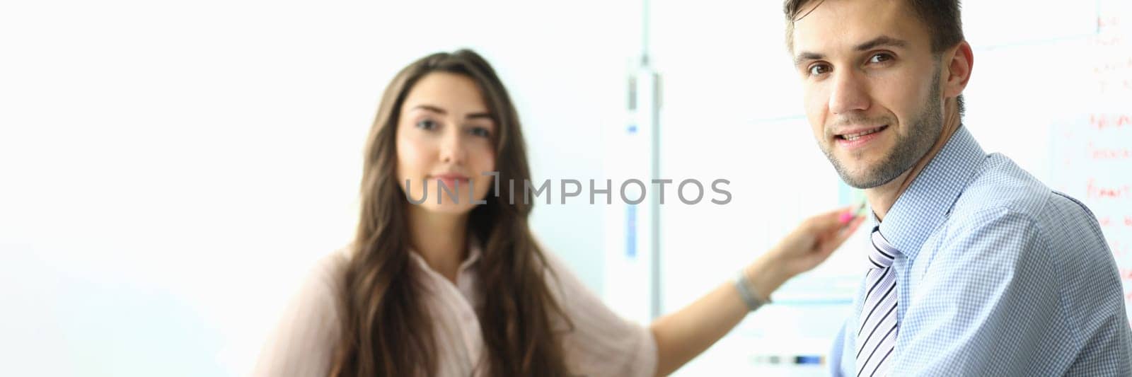 Portrait of business people sitting in office in meeting. Teamwork and business project concept