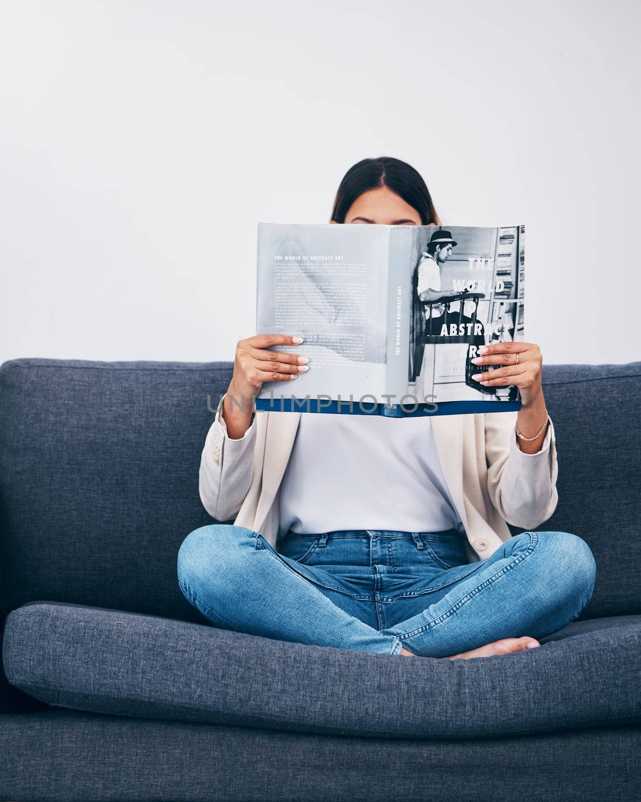 Relax, magazine or woman reading newspaper articles on sofa at home for information or story updates. Press, focus or person relaxing and studying abstract art for knowledge in a publication on couch.