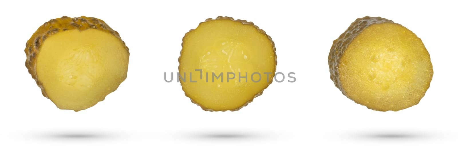 Pickles circles on a white isolated background. Slices of cucumbers scatter in different directions. The concept of a delicious addition to a dish or as an ingredient for a burger. by SERSOL