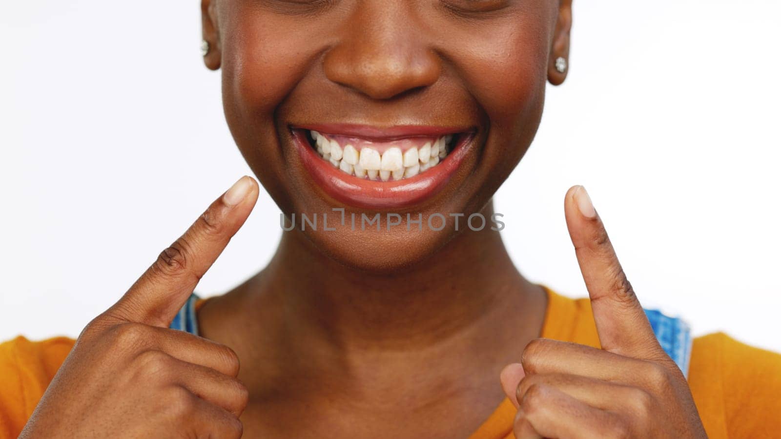 Happy isolated African American female smiling for tooth, mouth or gum and oral hygiene. Black woman, teeth and smile for dental care, whitening or healthcare against a white studio background